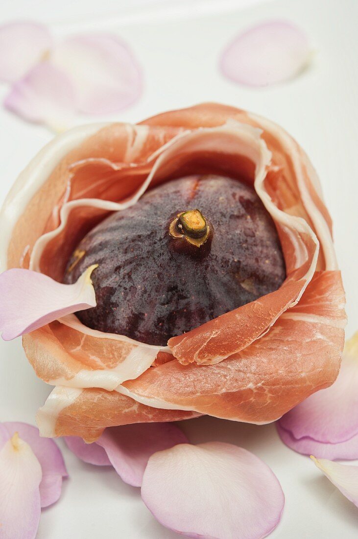 A fig wrapped in Parma ham