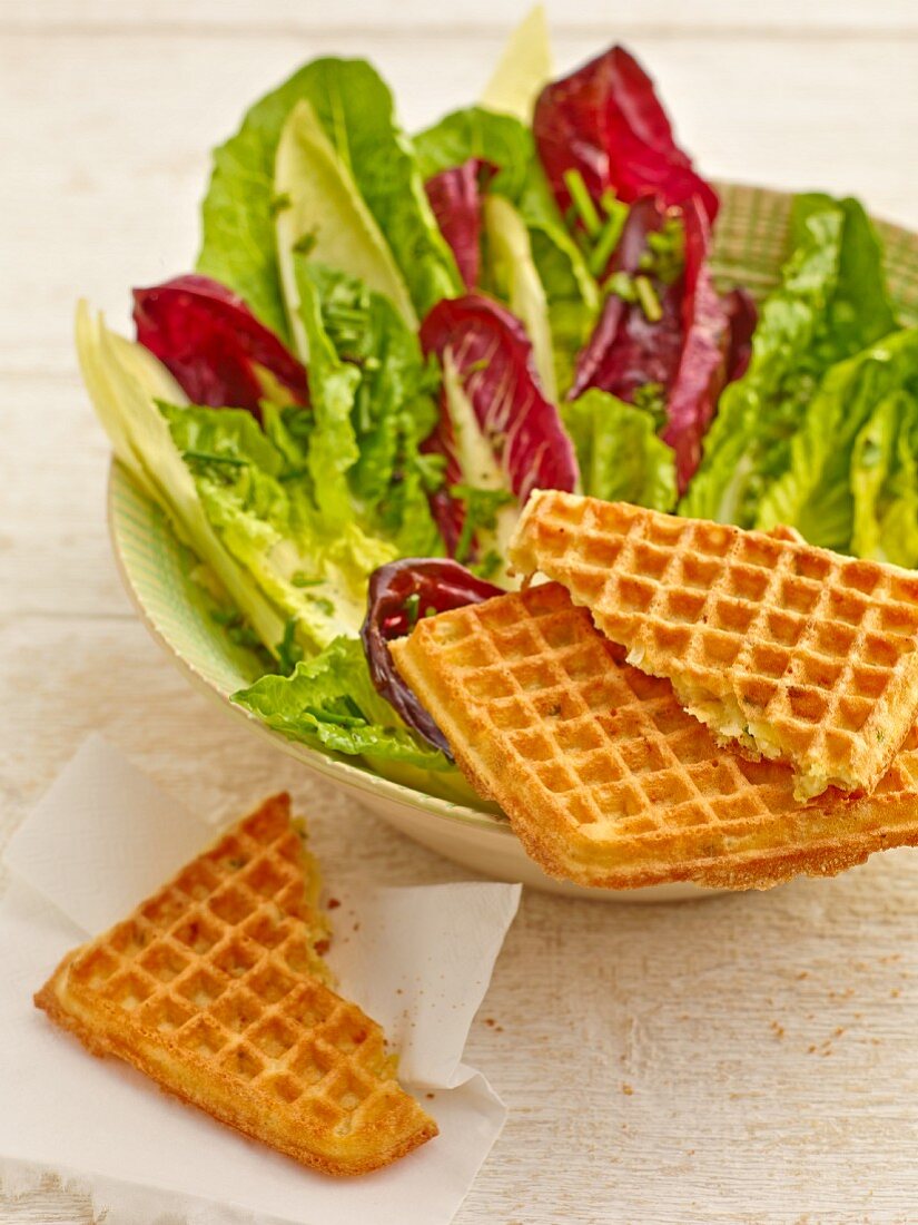 Potato waffles with a mixed leaf salad