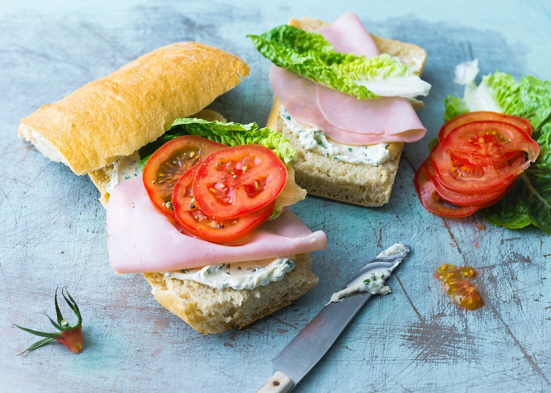 A cream cheese, ham and tomato sandwich