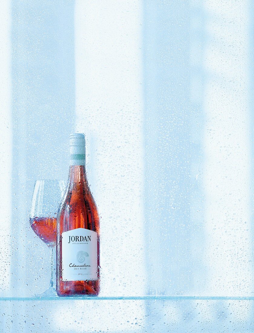 A bottle and a glass of 2012 Chameleon Dry Rosé, Jordan, Stellenbosch