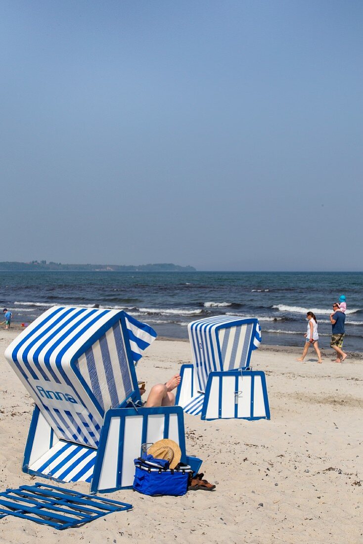 Blue-and-white beach chairs on the beach at Schaabe, Breege-Juliusruh