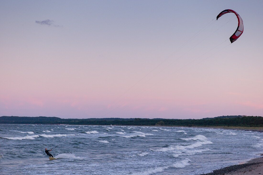 A kite surfer on the beach at Neu Mukran near Sassnitz, Rügen