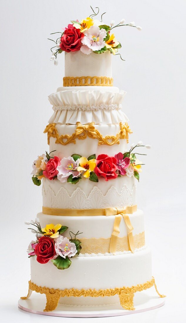 A baroque wedding cake decorated with sugar flowers