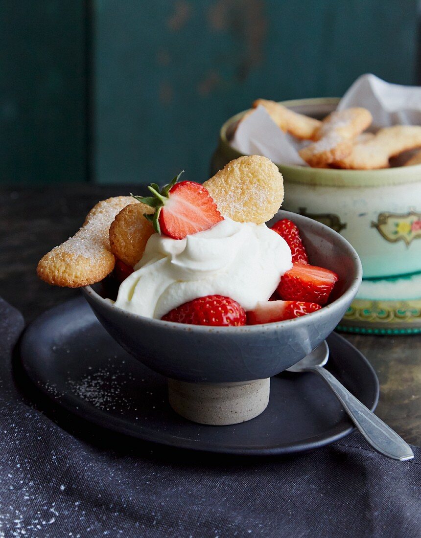 Dessert with strawberries, cream and homemade sponge biscuits