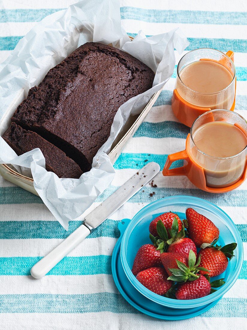Chocolate cake from Spain with strawberries and tea