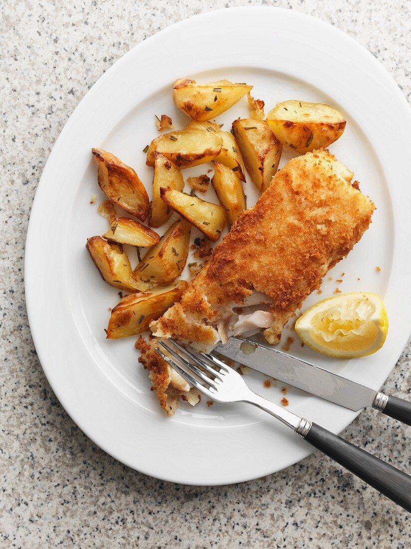 Fish and chips with a lemon wedge