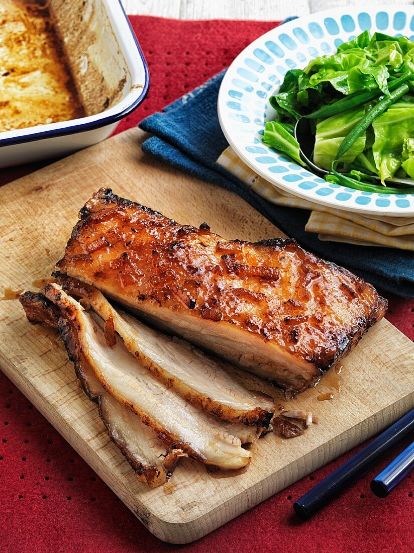 Slow Roasted Pork Belly With An Orange License Image 11316659 Image Professionals
