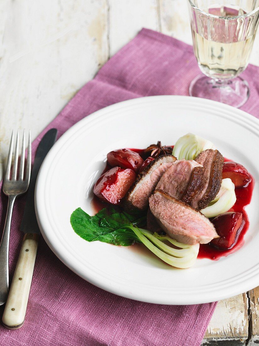 Crispy five-spice duck with plums and bok choy (Asia)