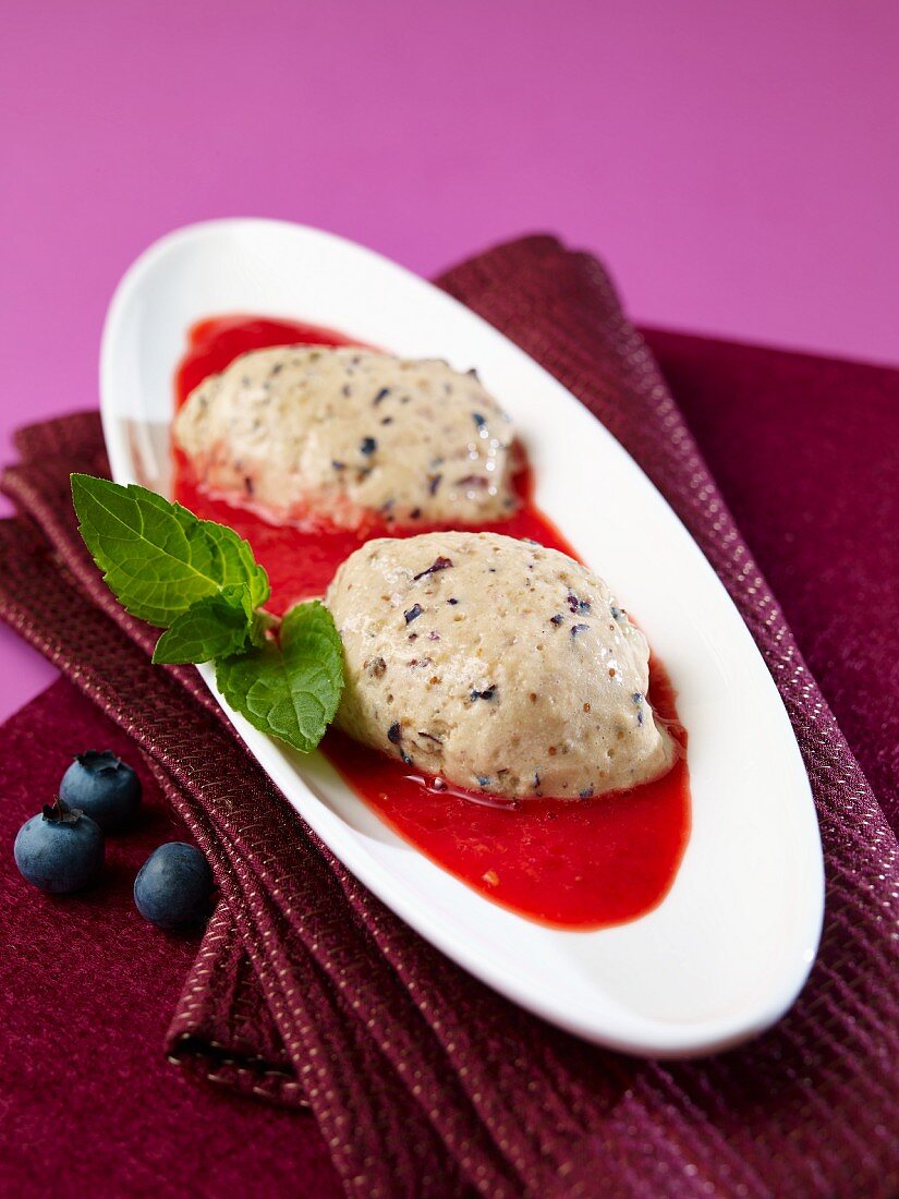 Blueberry and yogurt jelly with raspberry sauce