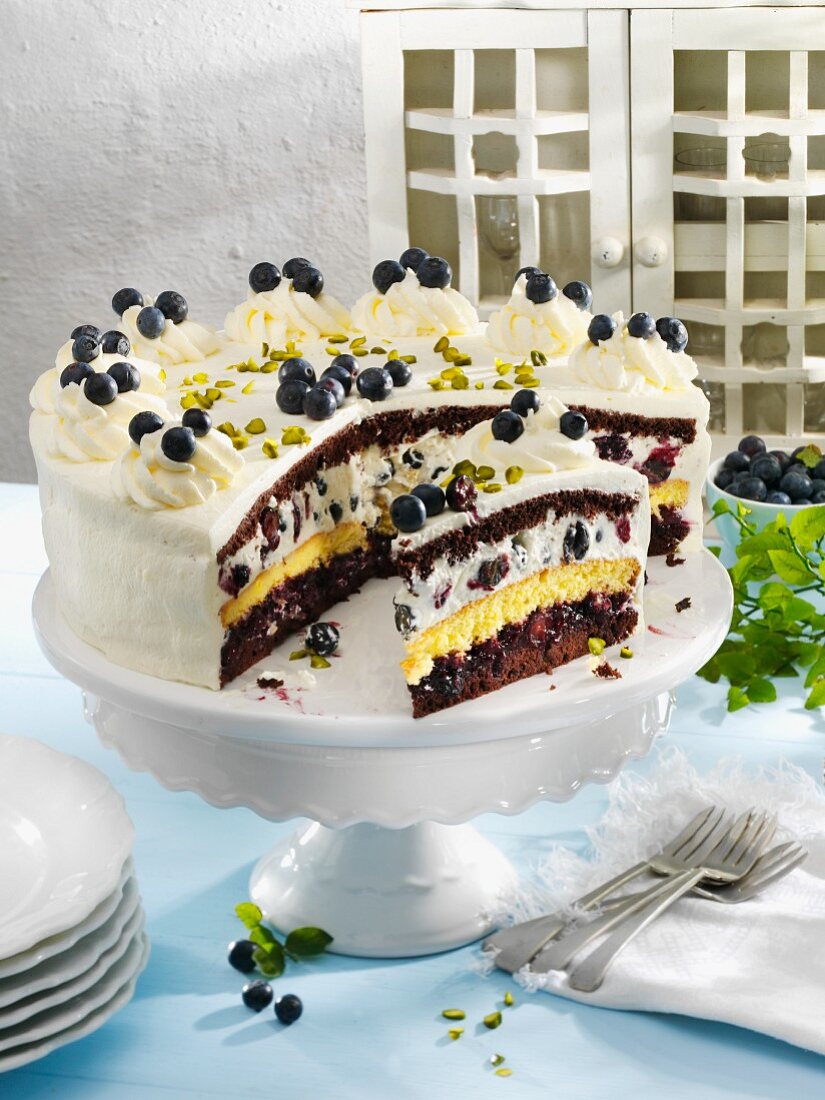 Creamy blueberry cake with four layers