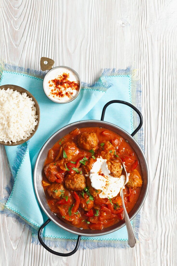 Meatballs in tomato sauce with peppers
