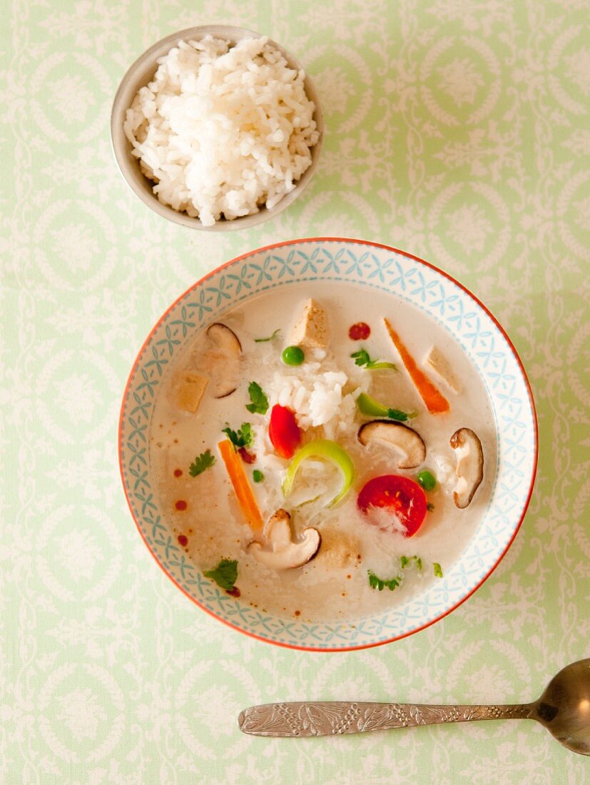 Coconut soup with mushrooms, vegetables and scented rice (Asia)