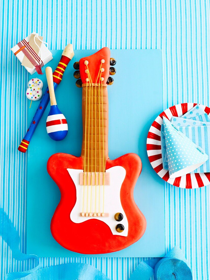 Funny cake in the shape of an electric guitar