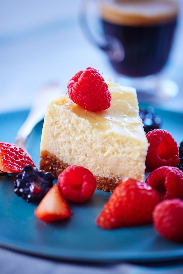 A slice of cheesecake with mixed berries