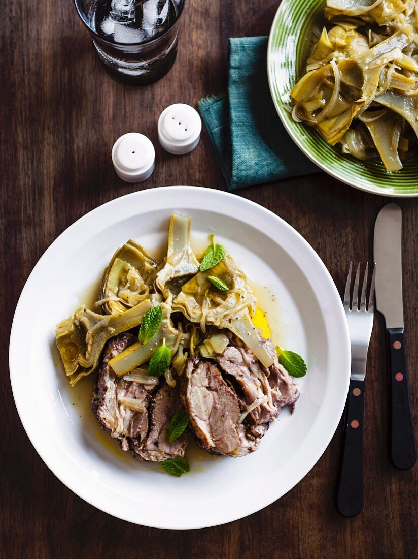 Slow-roasted lamb with sauteed artichokes and mint
