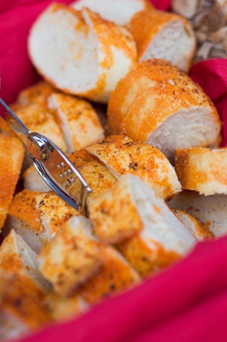 Sliced pepper bread in a bread basket