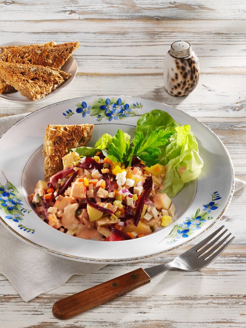 Vegetarian herring salad with smoked tofu and potatoes