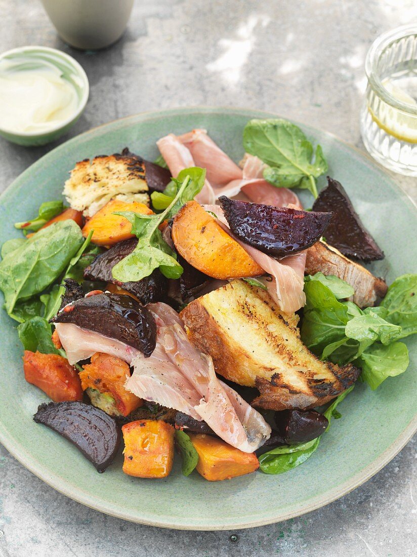 Roasted sweet potatoes with beetroot and Parma ham