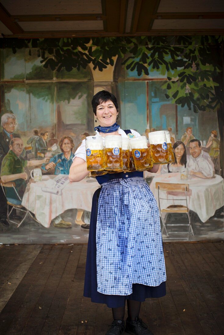 A waitress in a a Hofbräu festival tent at Oktoberfest, Munich