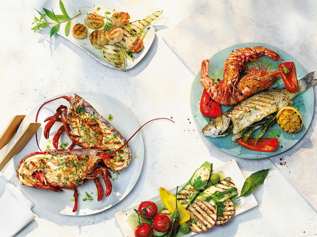 An arrangement of various different grilled fish dishes