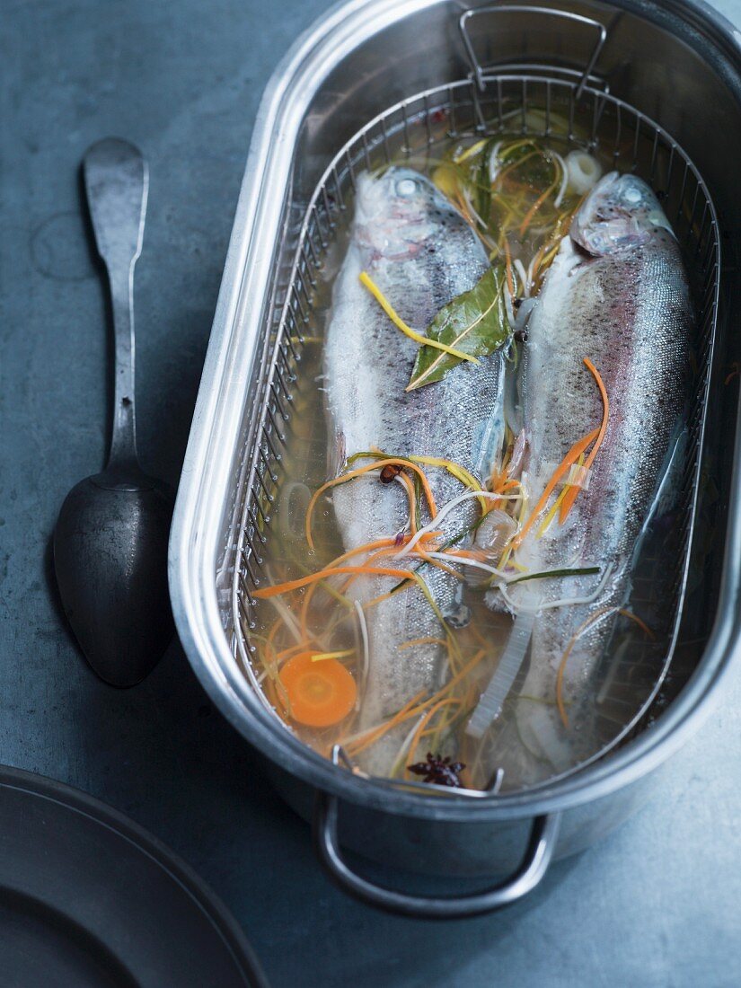 Poached trout in vegetable broth