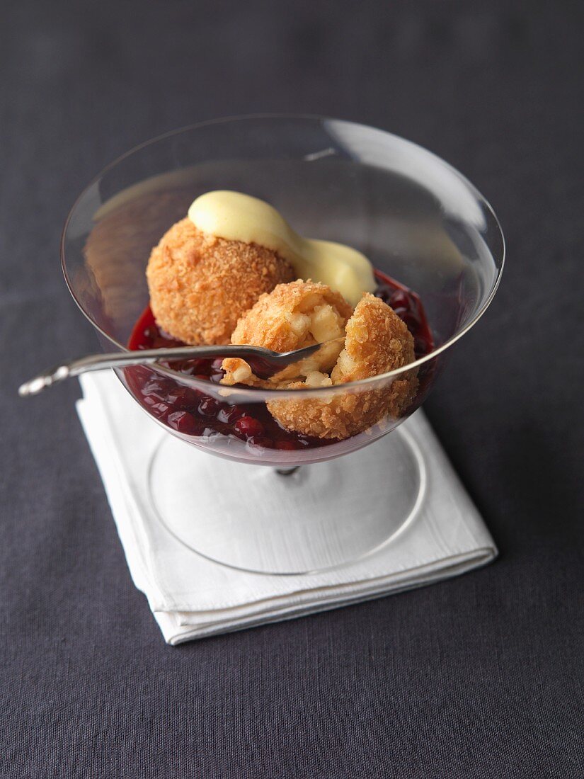 Apple dumplings with breadcrumbs and vanilla sauce