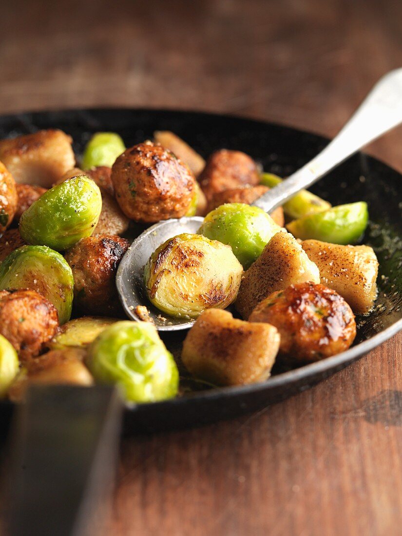 Gnocchi with chestnuts and Brussels sprouts in a pan