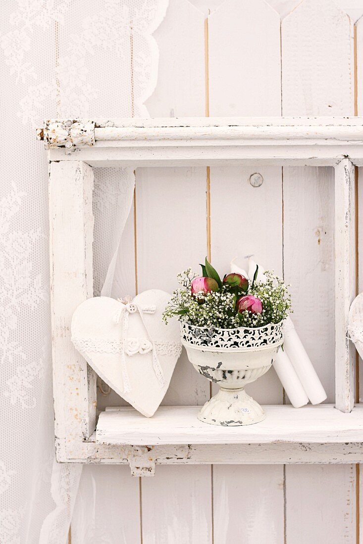 Wall decoration with love-heart & arrangement of roses and gypsophila