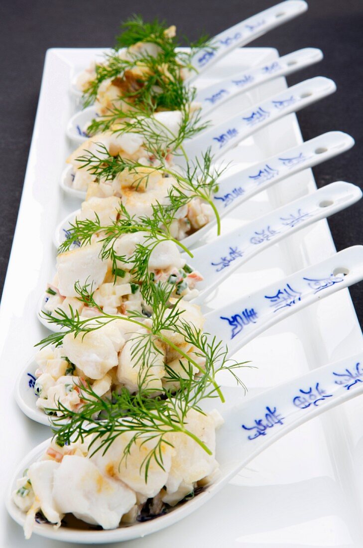 Fried cod with apple cream on canapé spoons