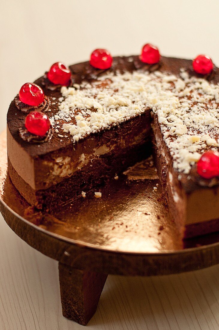 Black Forest Gateau with glace cherries, sliced