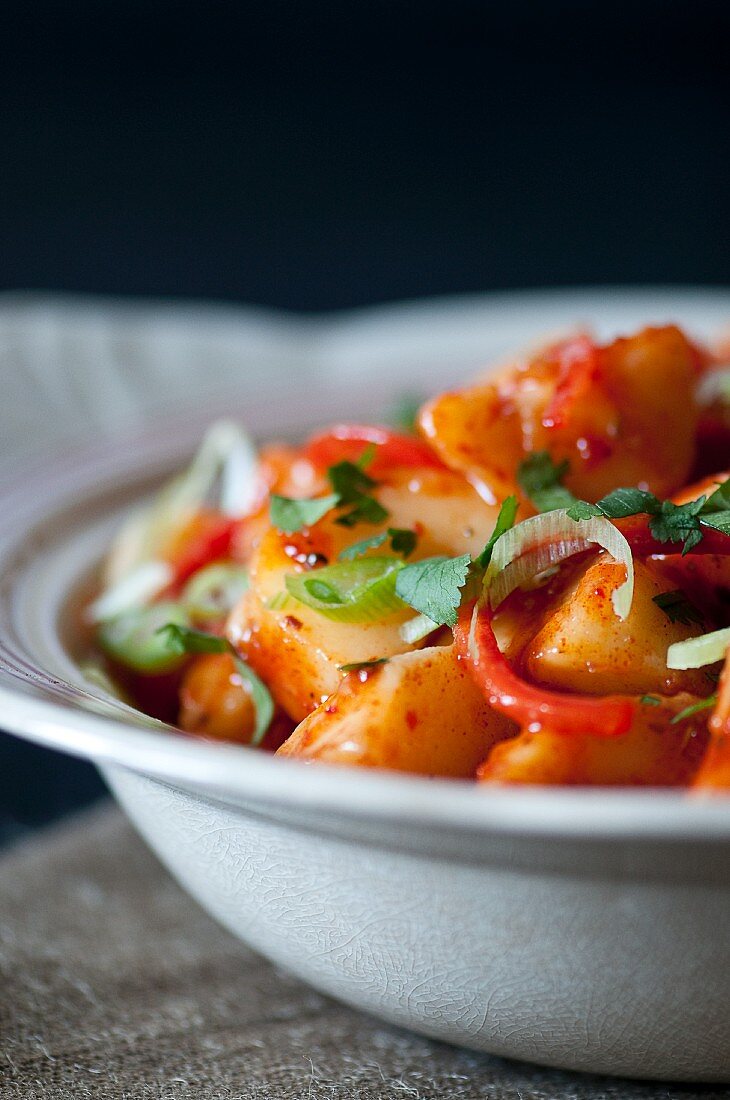 Potato curry with chilli peppers and spring onions