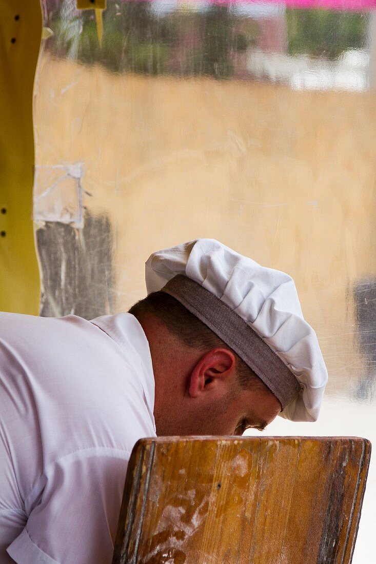 A chef working in a restaurant kitchen