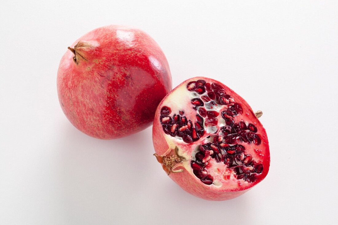 Pomegranate, whole and halved