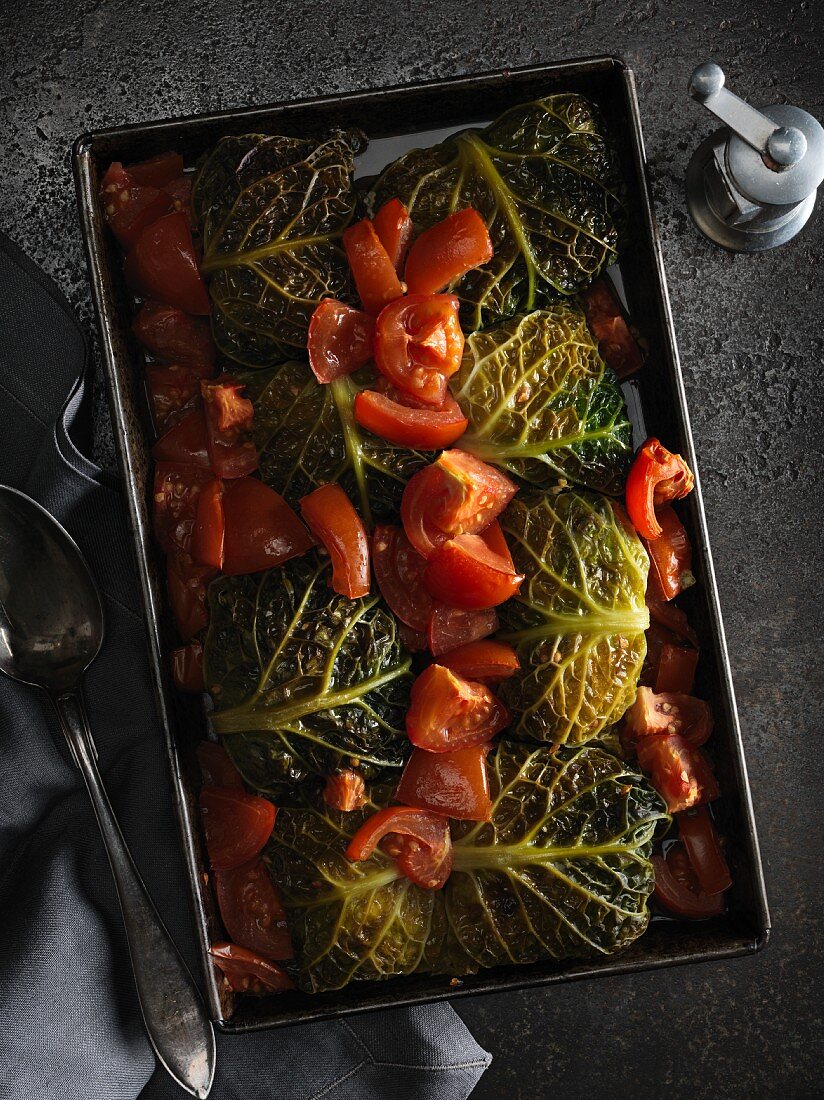 Oven-baked savoy cabbage parcels filled with pork and tomatoes