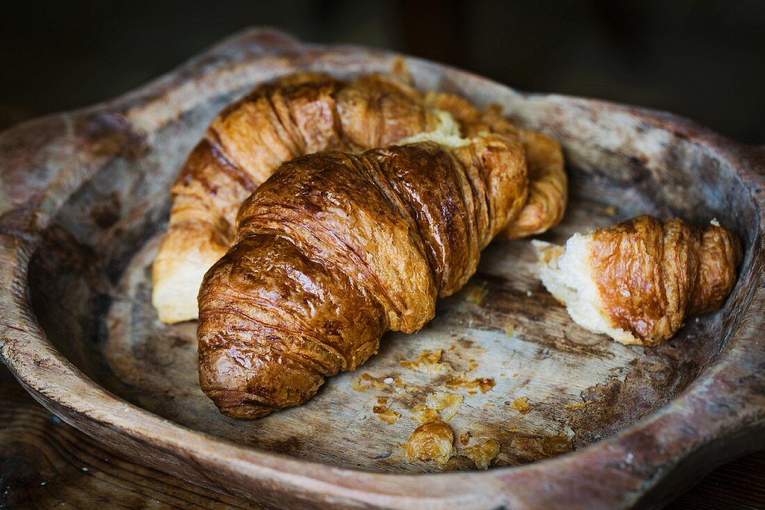 Croissant in a wooden bowl
