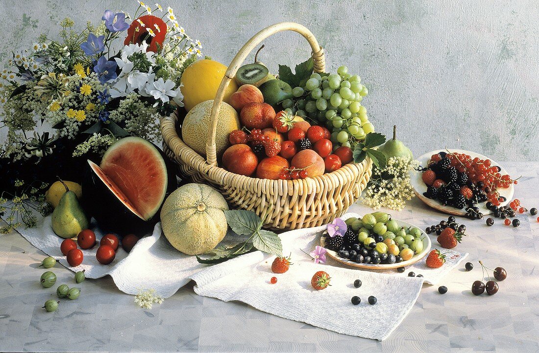 Assorted Fruit in a Basket and on Plates