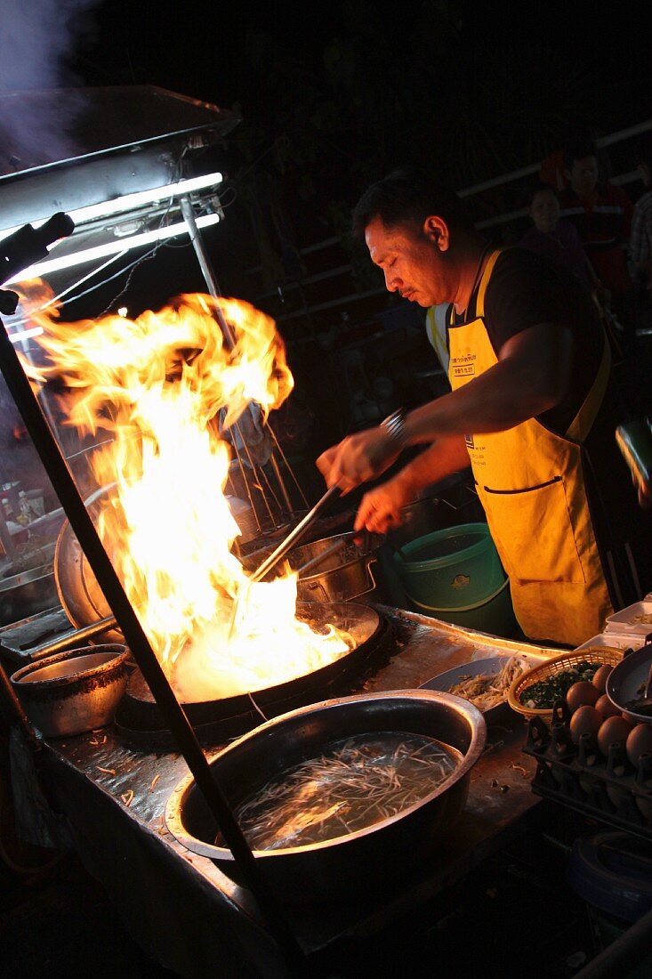 A cook in a Thai kitchen