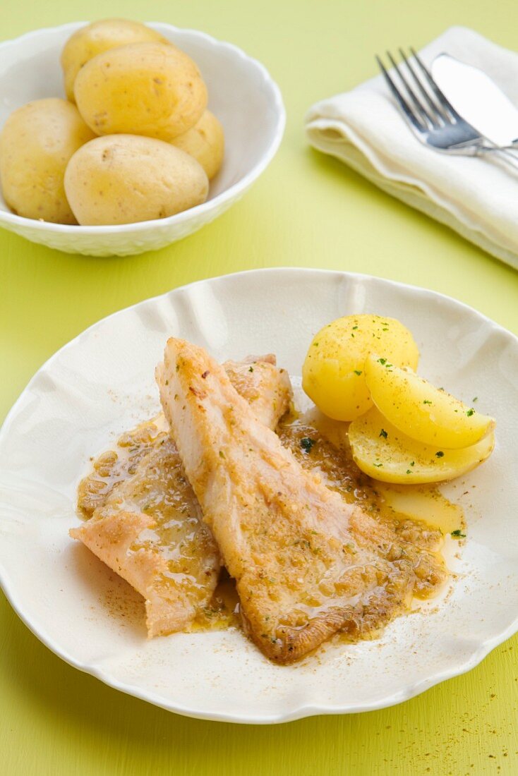 Ray fish with cumin and new potatoes