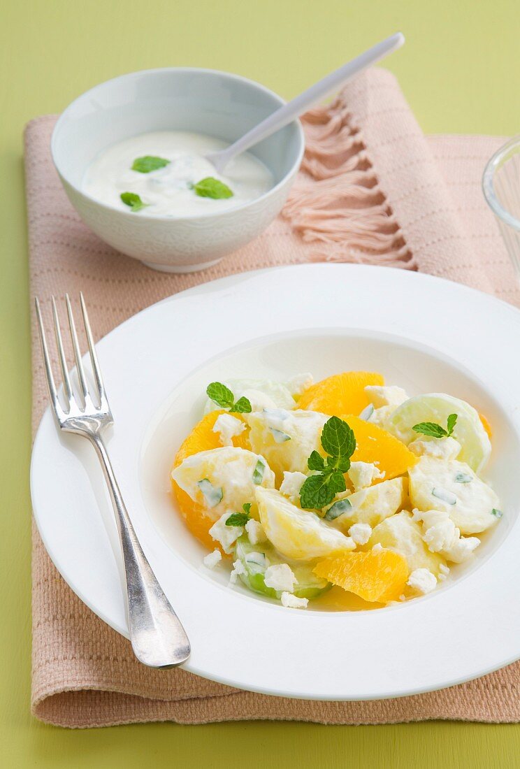 Potato salad with cucumber and oranges