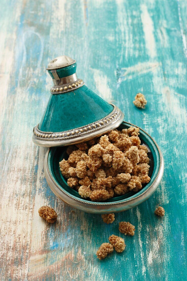 Dried mulberries in a tagine