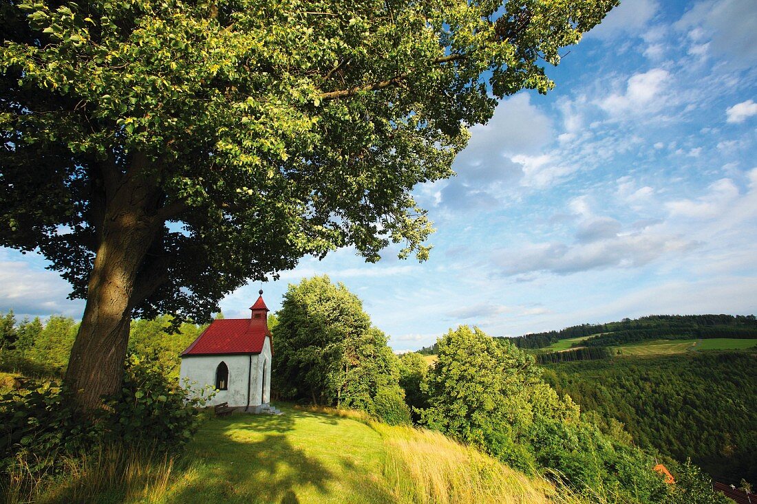 A chapel in a hilly landscape (Oberfanken, Germany)