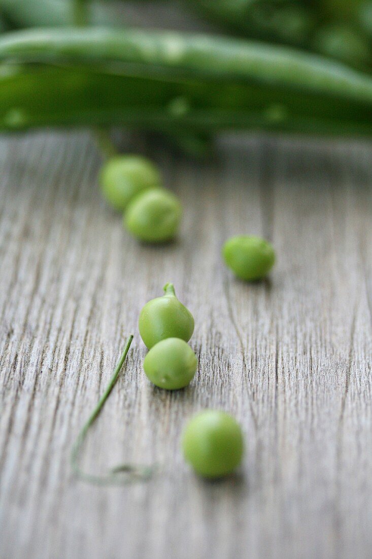 Peas on a wooden surface