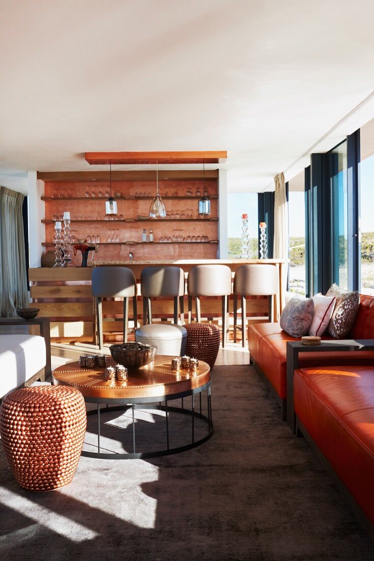 Designer side table and glass wall in lounge