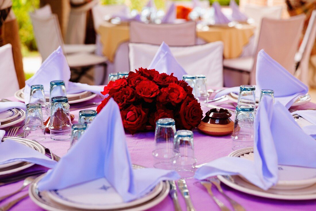 A fstively laid table in the restaurant at the Beldi Country Club, hotel complex on the outskirts of Marrakesh, Morocco