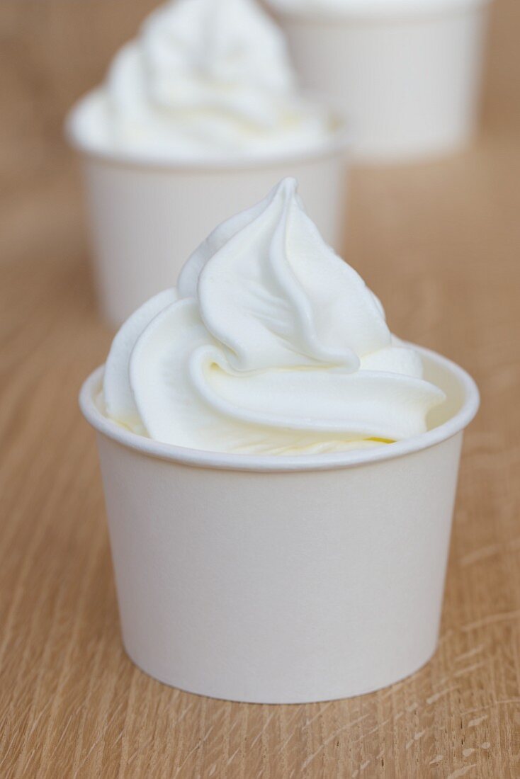 Frozen yoghurt in paper tubs