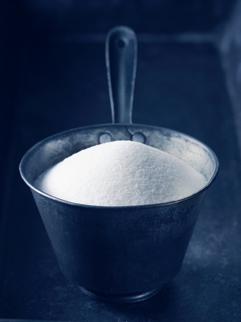 Sugar in a metal bowl