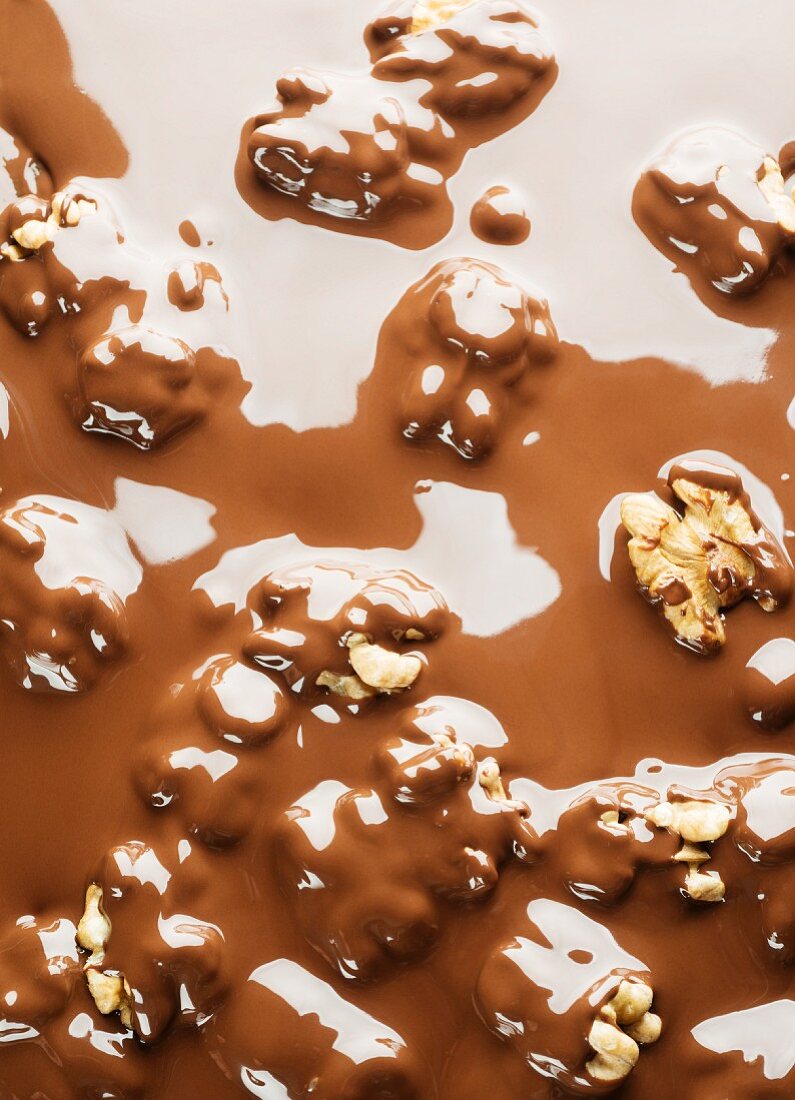 Walnuts in melted chocolate