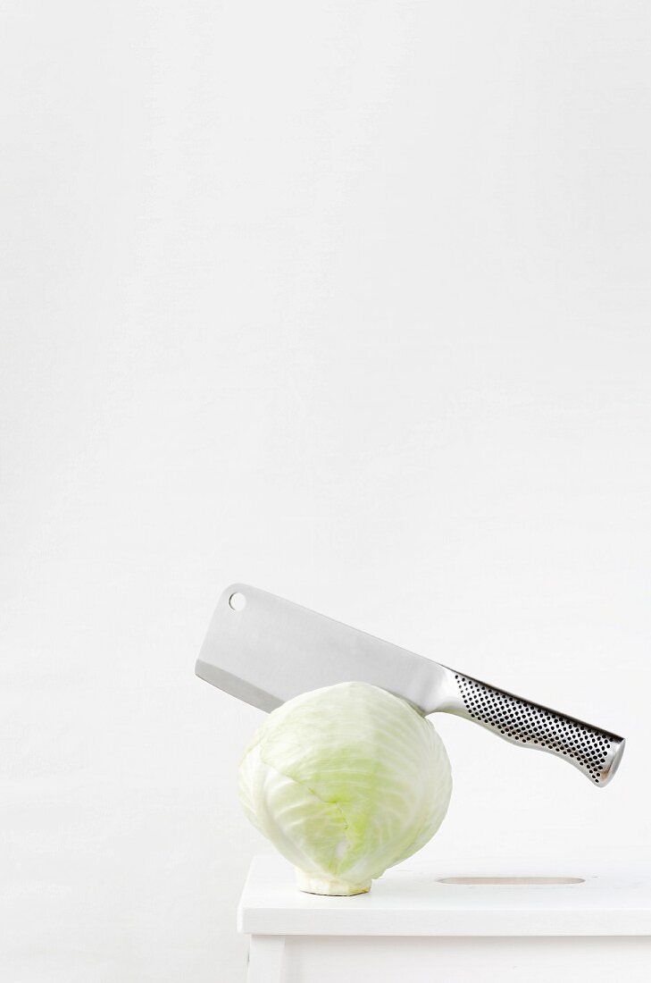 White cabbage with a meat cleaver
