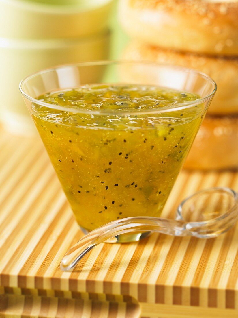 Kiwi, pineapple and orange marmalade in a glass bowl