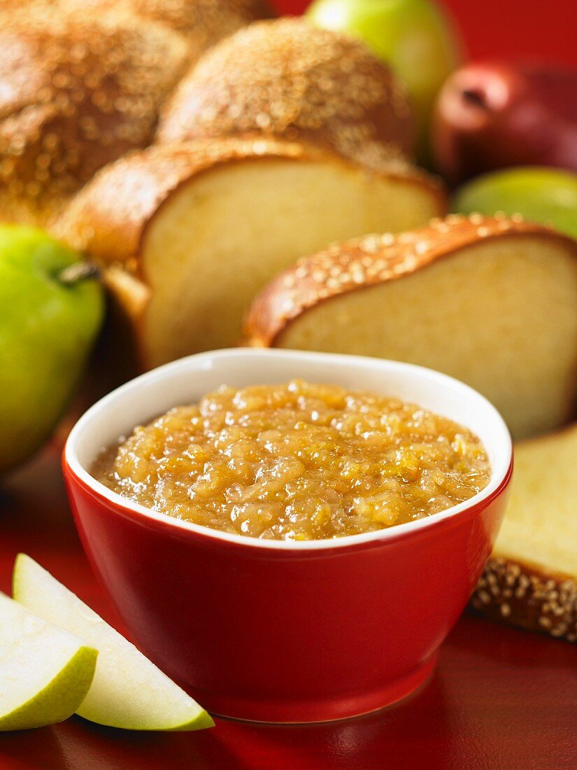 Pear spread and a plaited loaf of bread